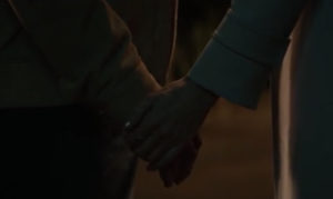 Hand holding The Old Man Hulu